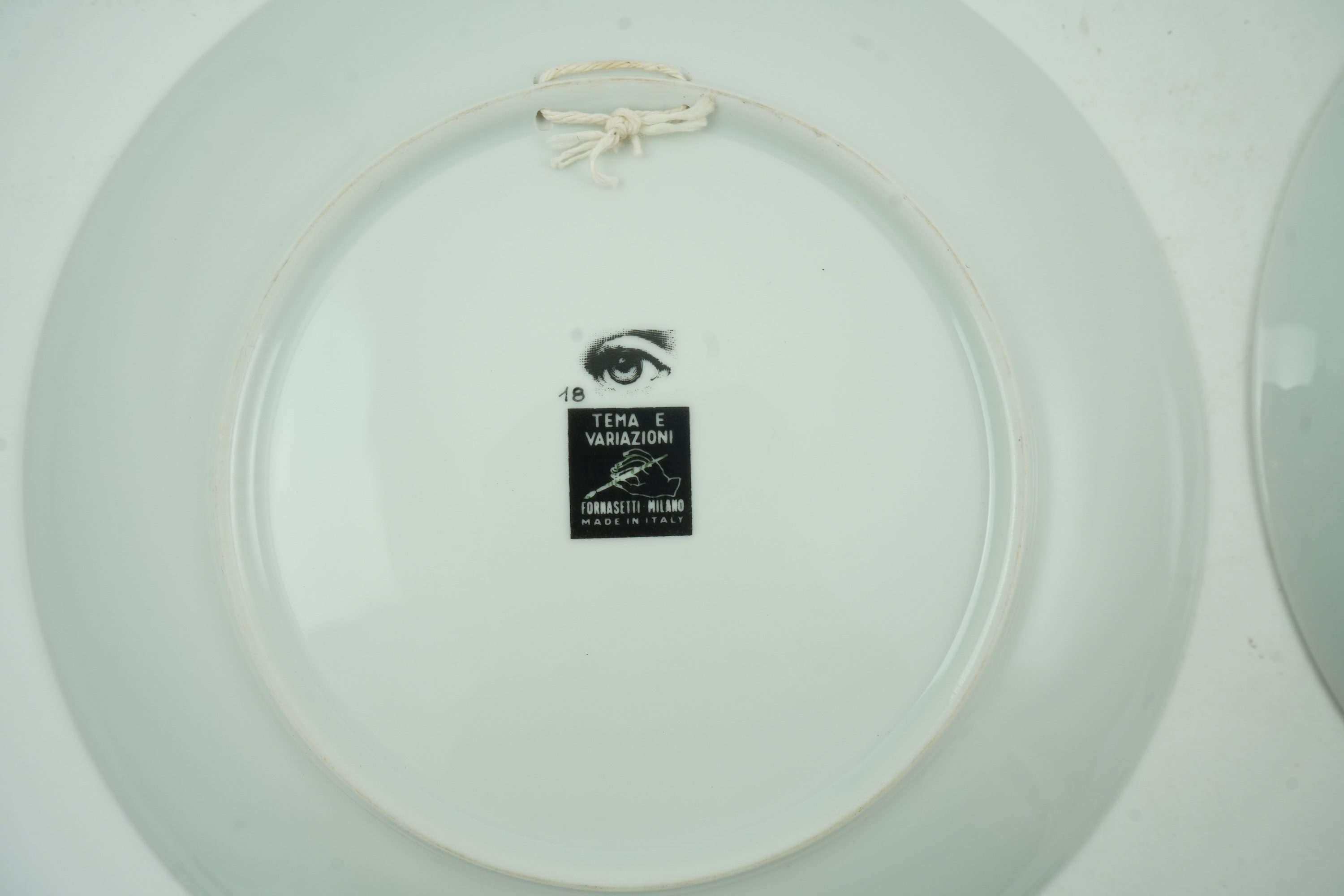 Piero Fornasetti (Italian, 1913-1988): Two 'Tema a Variazioni' plates